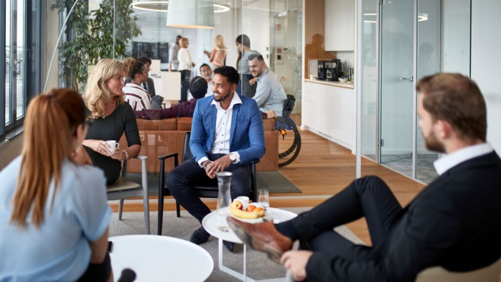 Employees have a casual conversation with each other