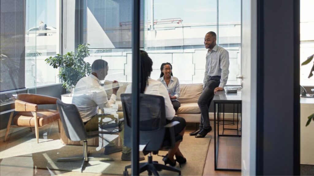 Group of employees taking a break in a casual office setting